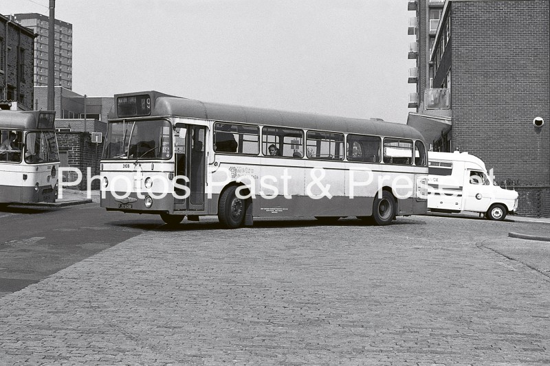 Metro Calderdale liveried Halifax Daimler Fleetline bus leaves old Crossfields bus station on its journey to Norton Tower in 1975. A Ford Transit Ambulance can be seen in the background.