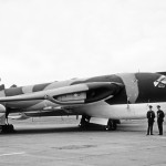 57 Military Airplane with Crew on Tarmac